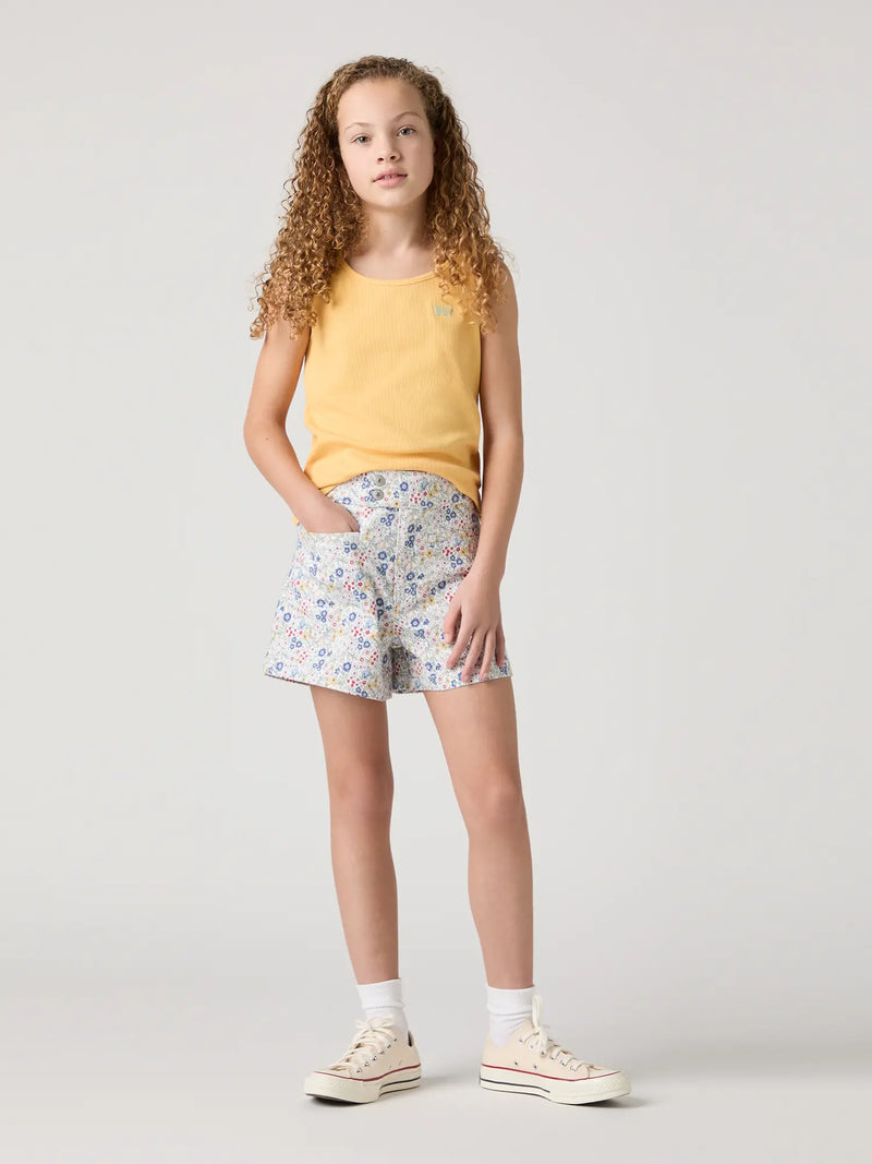 Girl wearing the Levi's floral print shorts.