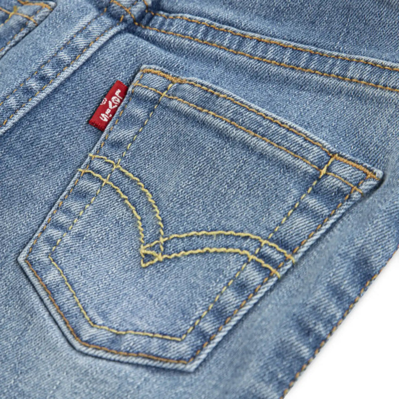 Closer look at the Levi's mid wash jeans.