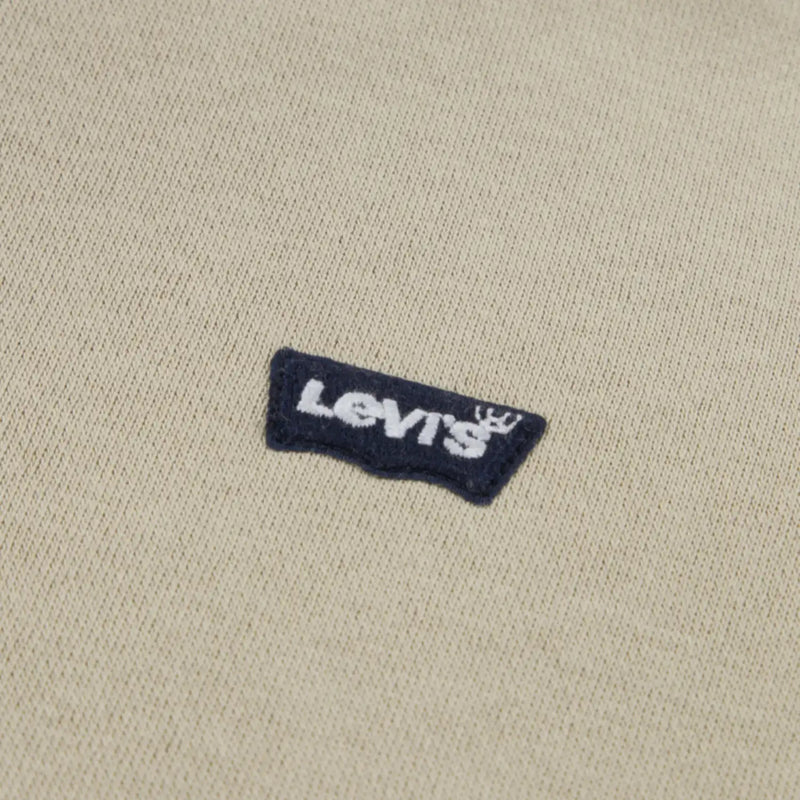 Closer look at the Levi's mini logo tracksuit showing detail of the navy batwing logo.