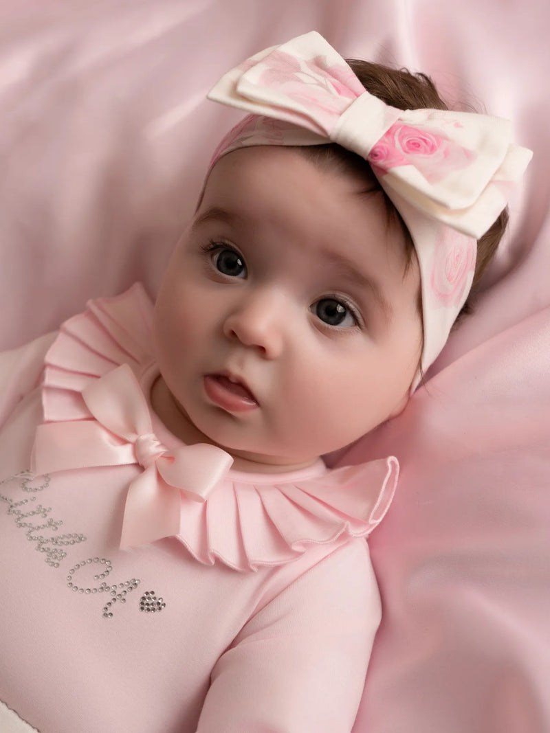 Baby girl wearing the Little A dana headband.