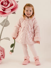 Baby girl modelling the Little A dolly coat.