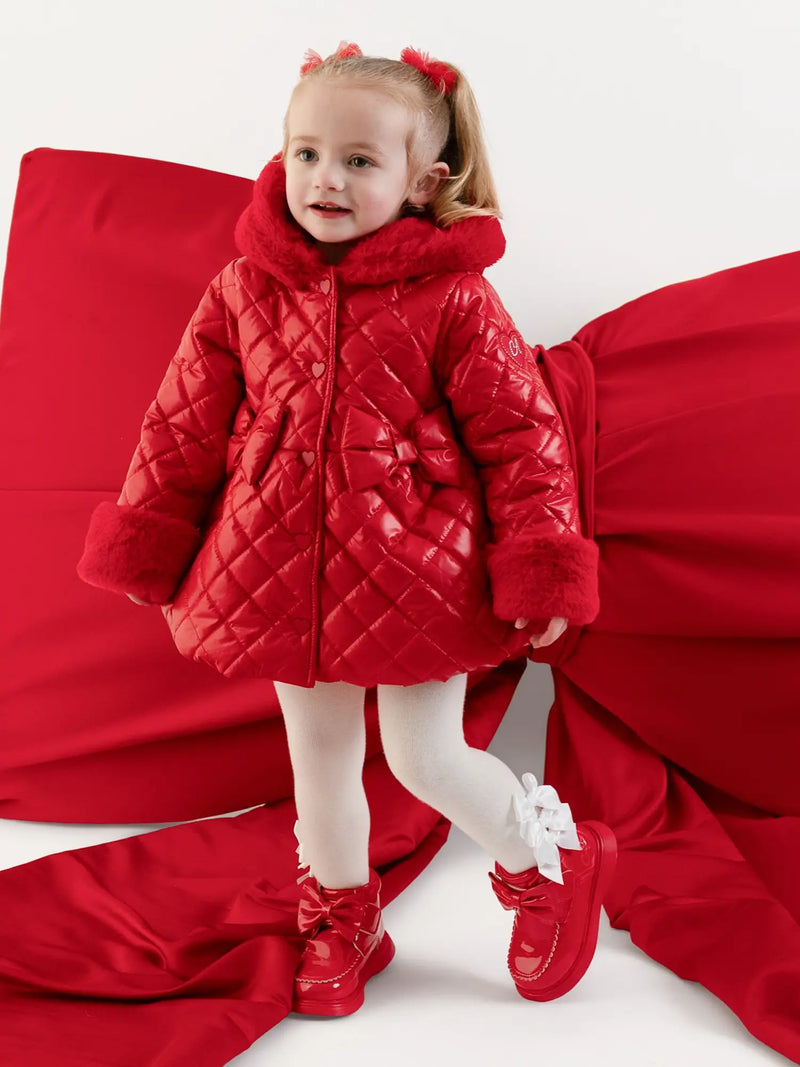 Little A red dolly coat, modelled by baby girl.