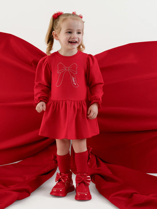Baby girl modelling the Little A esme dress.