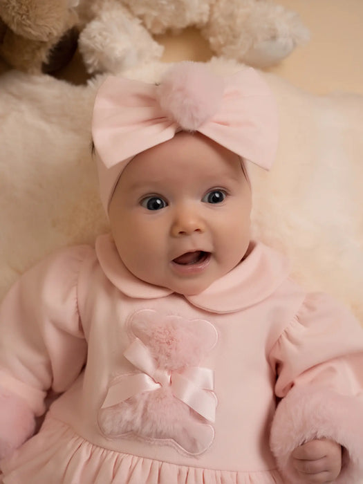 Smiling baby girl modelling the Little A gaby headband.