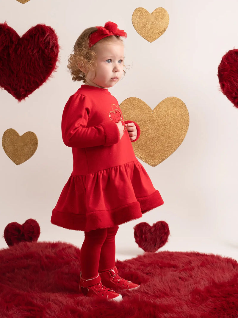 Girl wearing the Little A harmony dress.