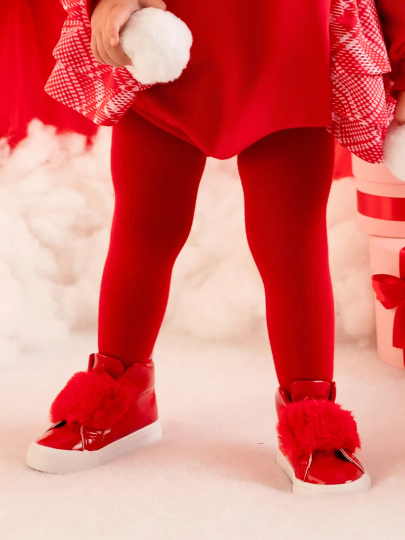 Baby girl wearing the Little A kamila tights.