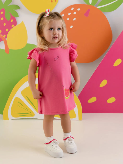 Baby girl wearing the Little A paisley dress.