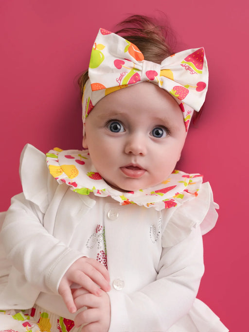 Baby girl wearing the Little A piper headband.