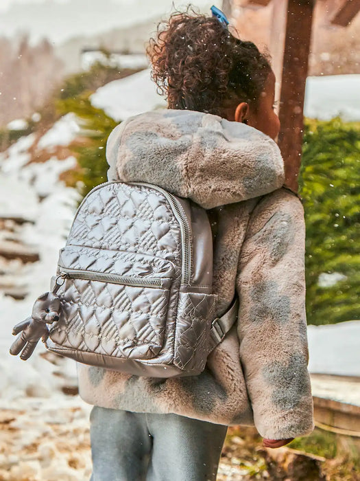 Girl wearing the Mayoral backpack.