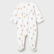 Baby girl's white babygrow with balloon pattern.
