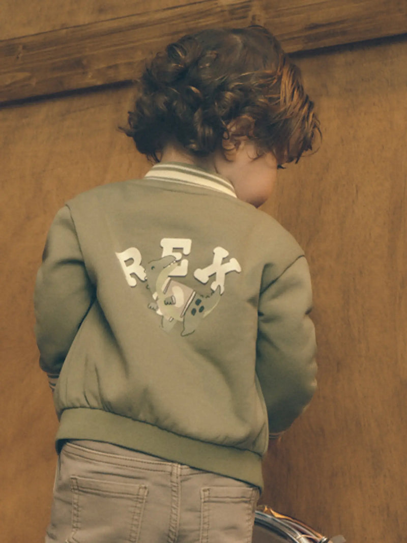 Mayoral baseball jacket with a large dinosaur logo on the back.
