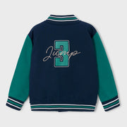 Mayoral varsity jacket with large embroidered logo on the back.