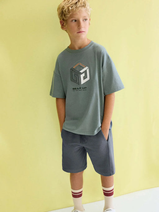 Boy wearing the Mayoral bermuda shorts set.