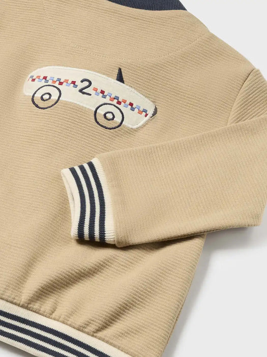 Beige Mayoral jacket with race car embroidery.