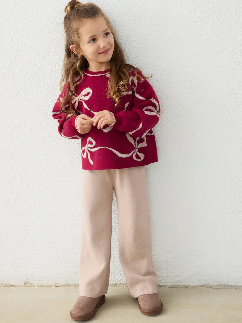 Girl wearing the Mayoral bow jumper set.