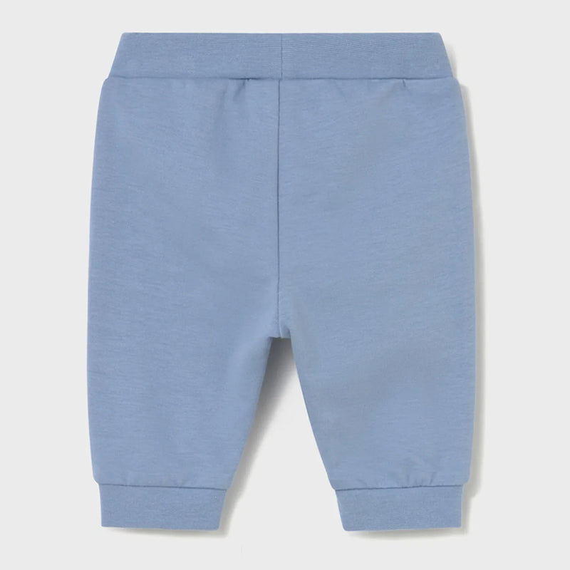 Newborn boy's blue track bottoms.