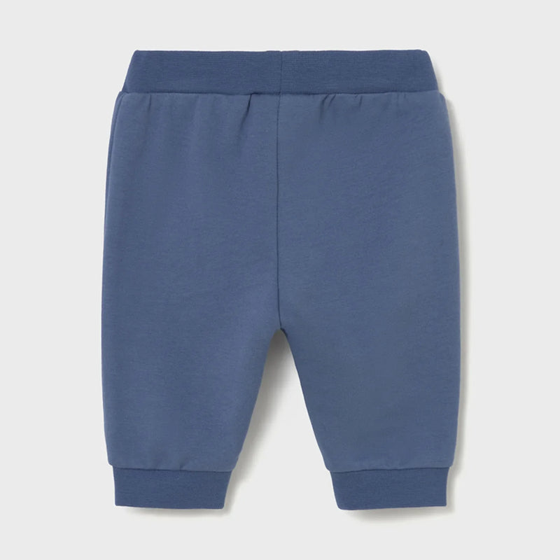 Newborn boy's dark blue track bottoms.