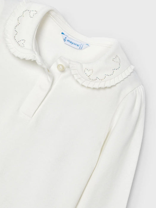 Long sleeve top with rounded collar.