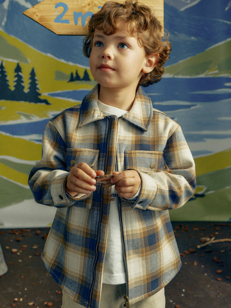 Boy wearing the Mayoral checked jacket.