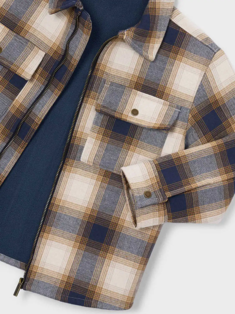 Closer look at the Mayoral checked jacket showing detail of the warm inner lining.