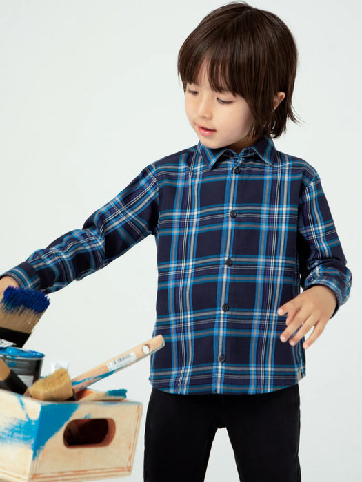 Boy modelling the Mayoral checked shirt.