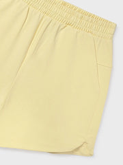 Closer view of the girls yellow track shorts.