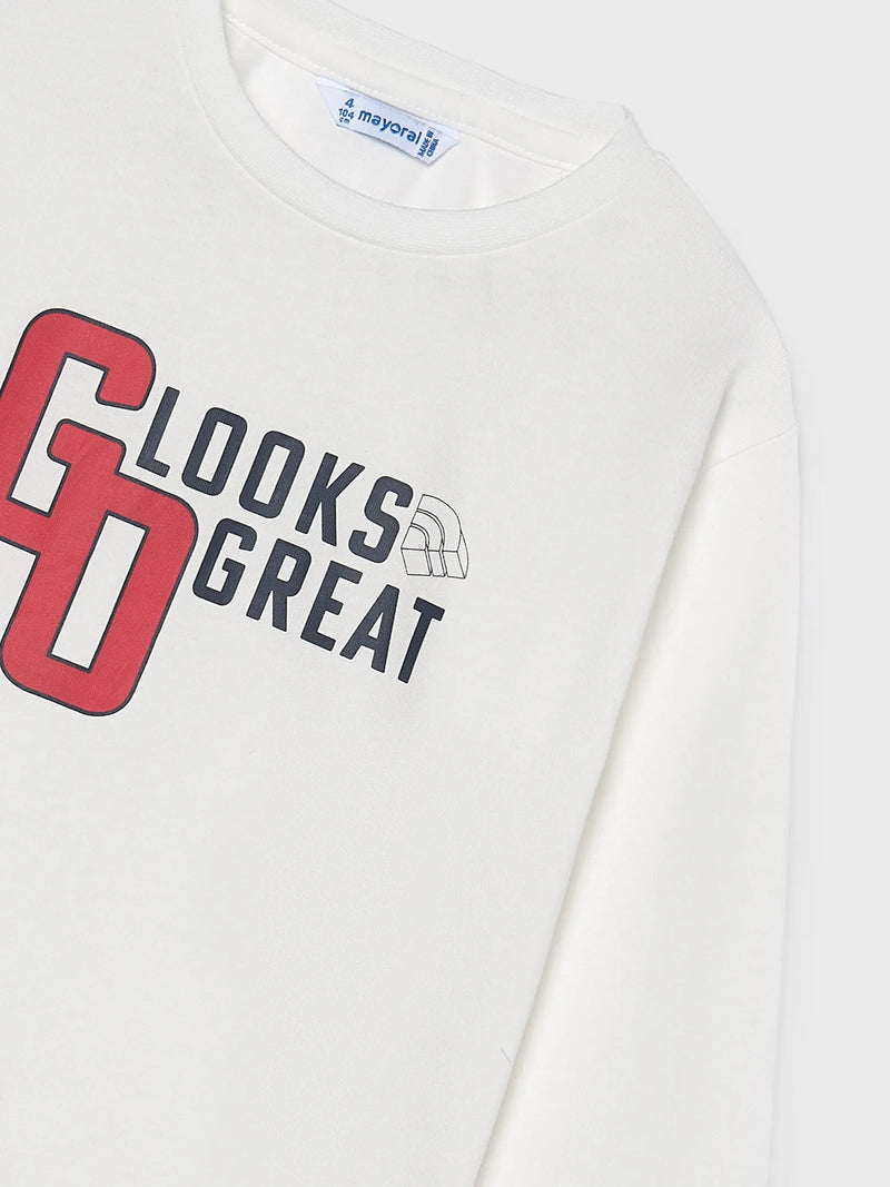 Closer view of the white, long sleeve t-shirt.