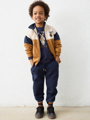 Smiling Boy modelling the Mayoral colourblock tracksuit.