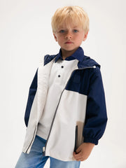 Boy modelling the Mayoral colourblock windbreaker.