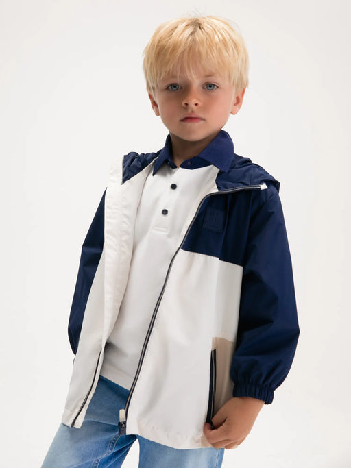 Boy modelling the Mayoral colourblock windbreaker.