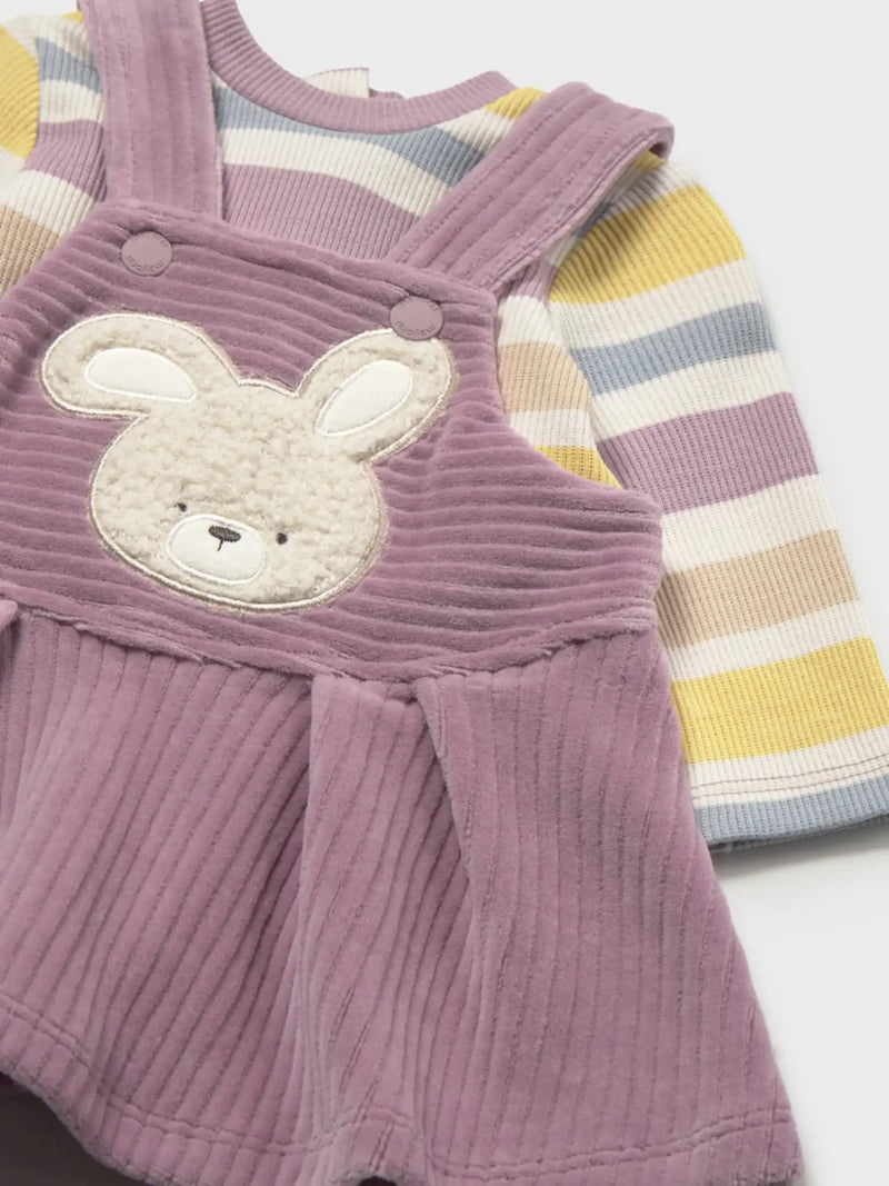 Closer look at the Mayoral corduroy pinafore showing detail of the fuzzy bunny appliqué on the chest.