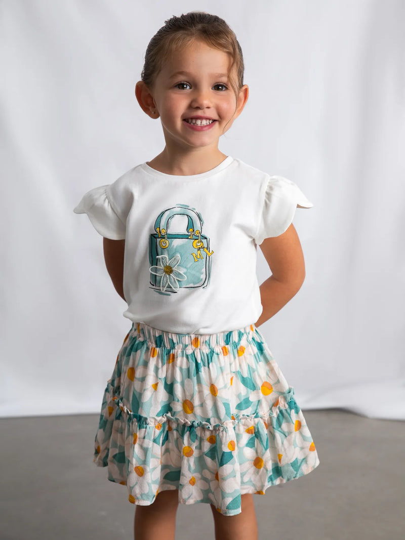Girl wearing the Mayoral daisy print skirt set.