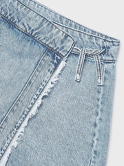 Closer look at the Mayoral denim skort showing detail of the frayed trim.