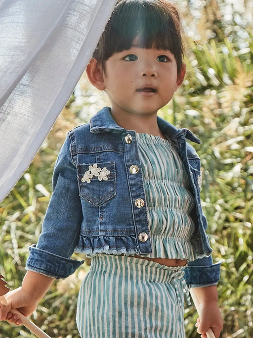 Baby girl wearing the Mayoral denim jacket.