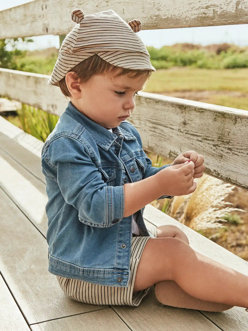 Baby boy wearing the Mayoral denim jacket.