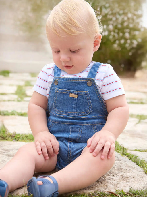 Baby boy wearing the Mayoral denim romper set.