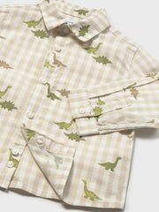 Closer view of the Mayoral dinosaur shirt.