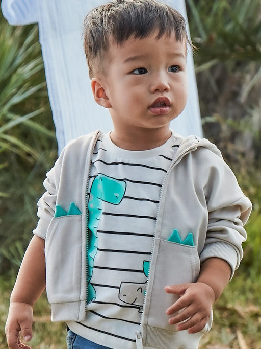 Boy wearing the Mayoral dinosaur t-shirt.