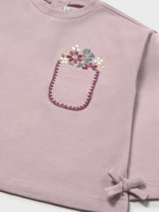 Closer look at the Mayoral embroidered top showing detail of the embroidered flowers on the chest.