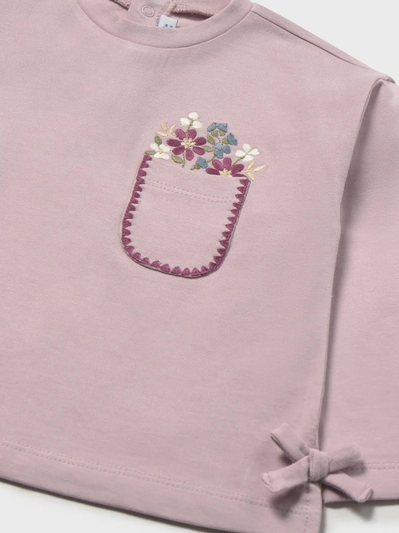 Closer look at the Mayoral embroidered top showing detail of the embroidered flowers on the chest.