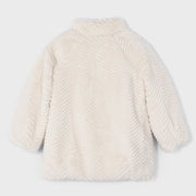 Rear view of the Mayoral beige faux fur coat.