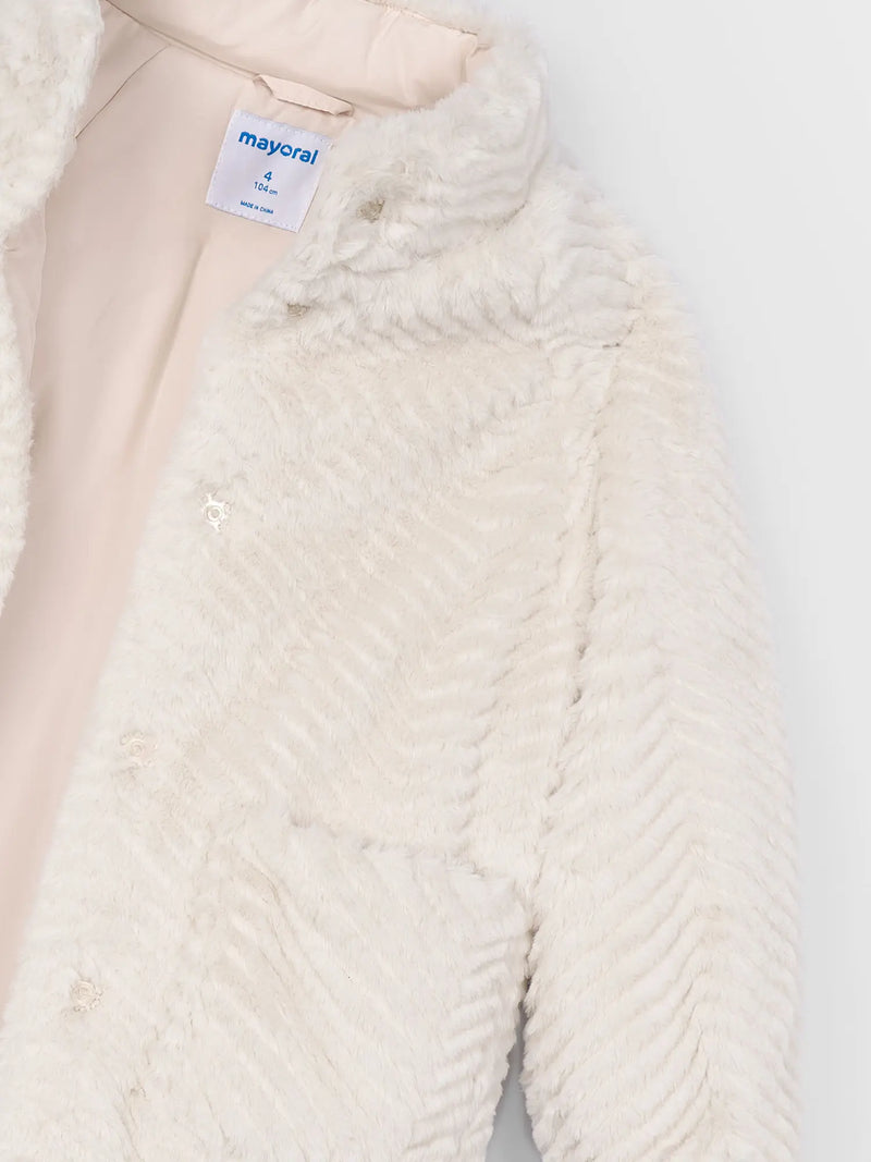 Closer look at the Mayoral faux fur coat showing detail of the wavy ridged design