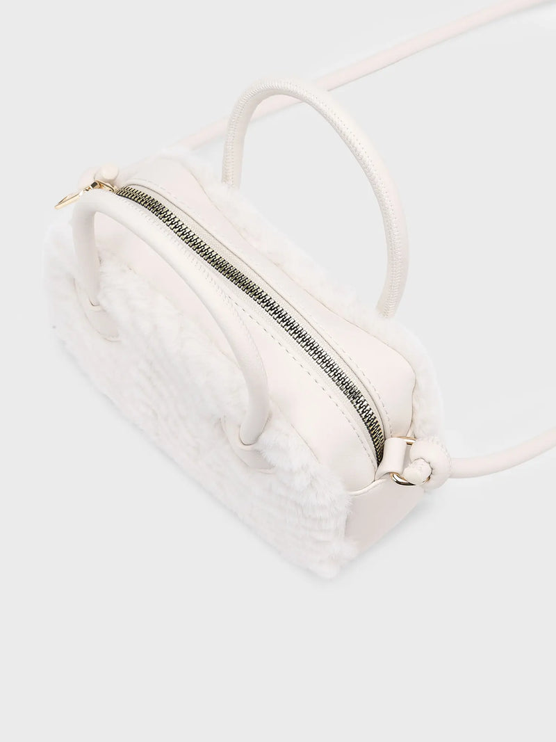 Closer view of the Mayoral faux fur handbag.