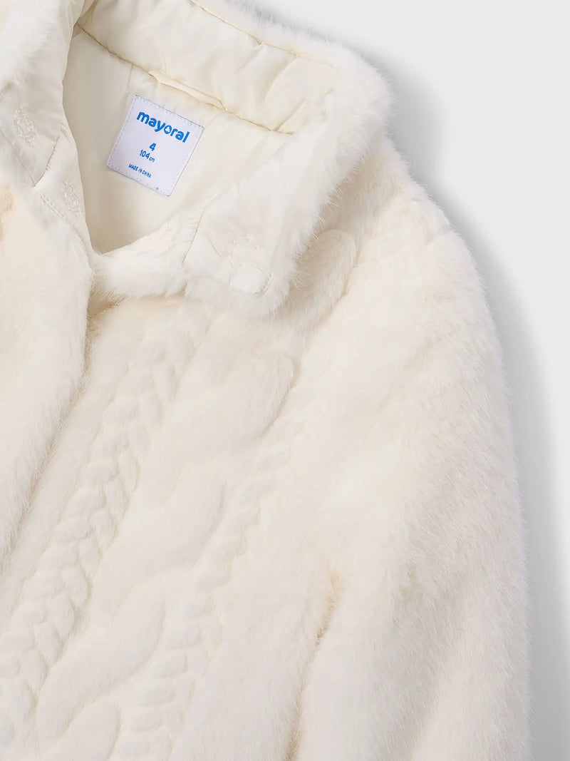 Closer look at the Mayoral faux fur jacket showing detail of the cable knit design on the front.