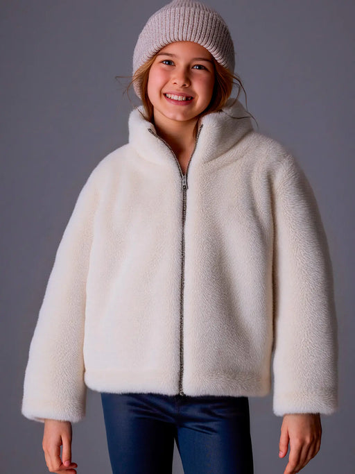 Mayoral beige faux fur jacket, modelled by girl.