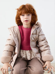 Girl wearing the Mayoral faux fur puffer jacket.