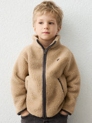 Boy in brown fleece jacket by Mayoral.