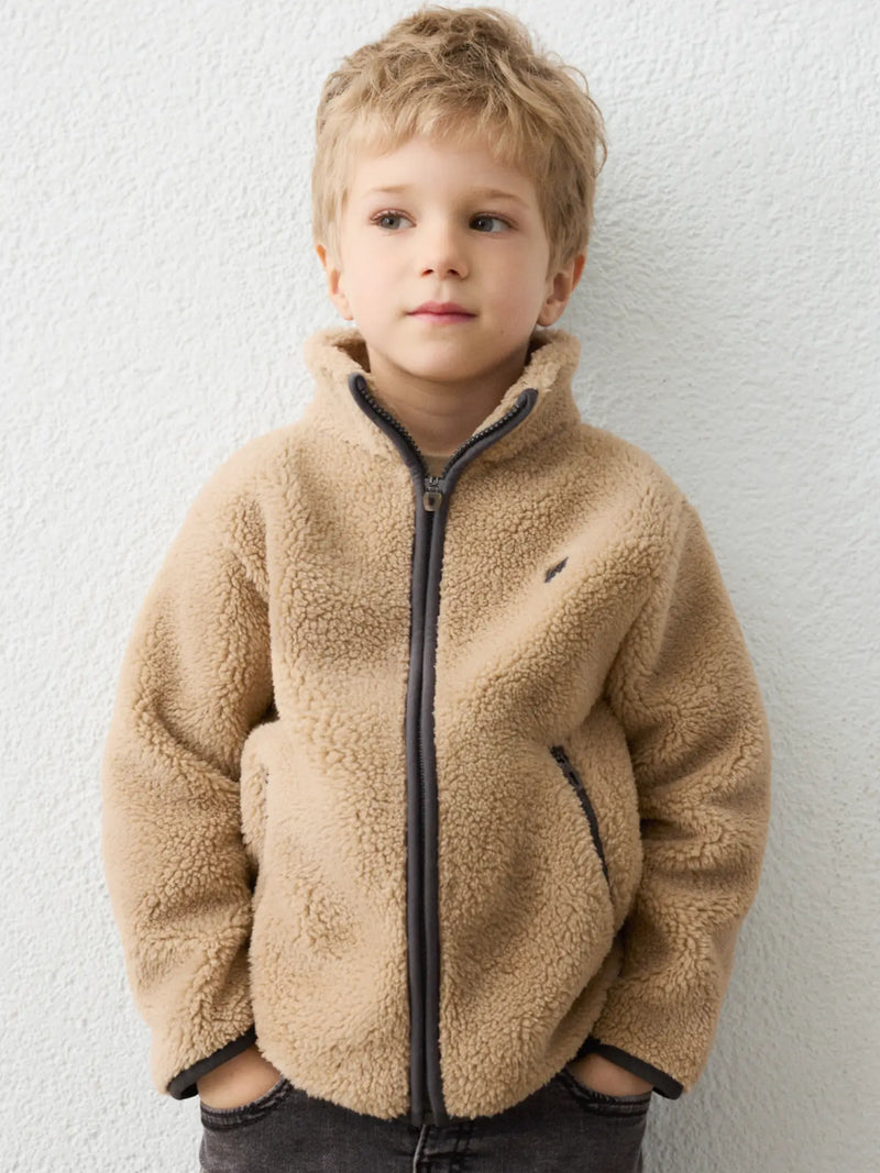 Boy in brown fleece jacket by Mayoral.