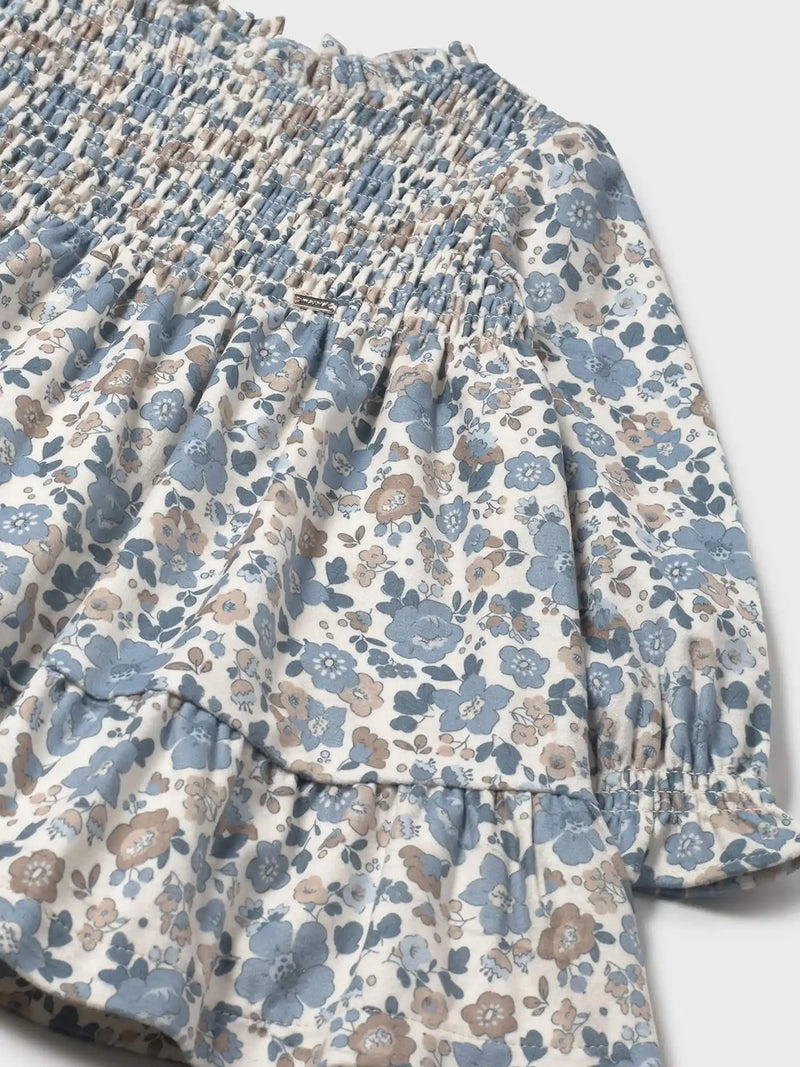 Mayoral smocked dress with gold logo badge on the chest.