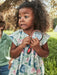 Girl wearing the Mayoral floral print dress.